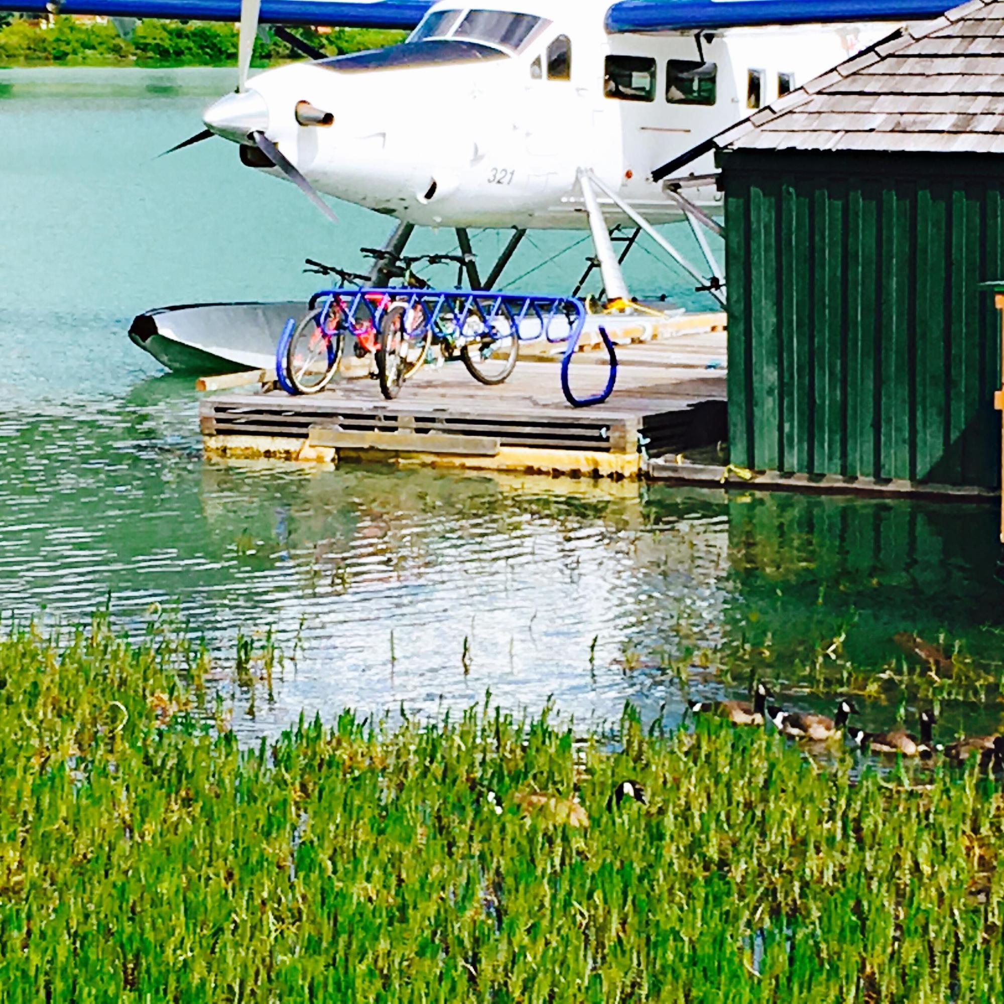 plane and bikes on doc near water