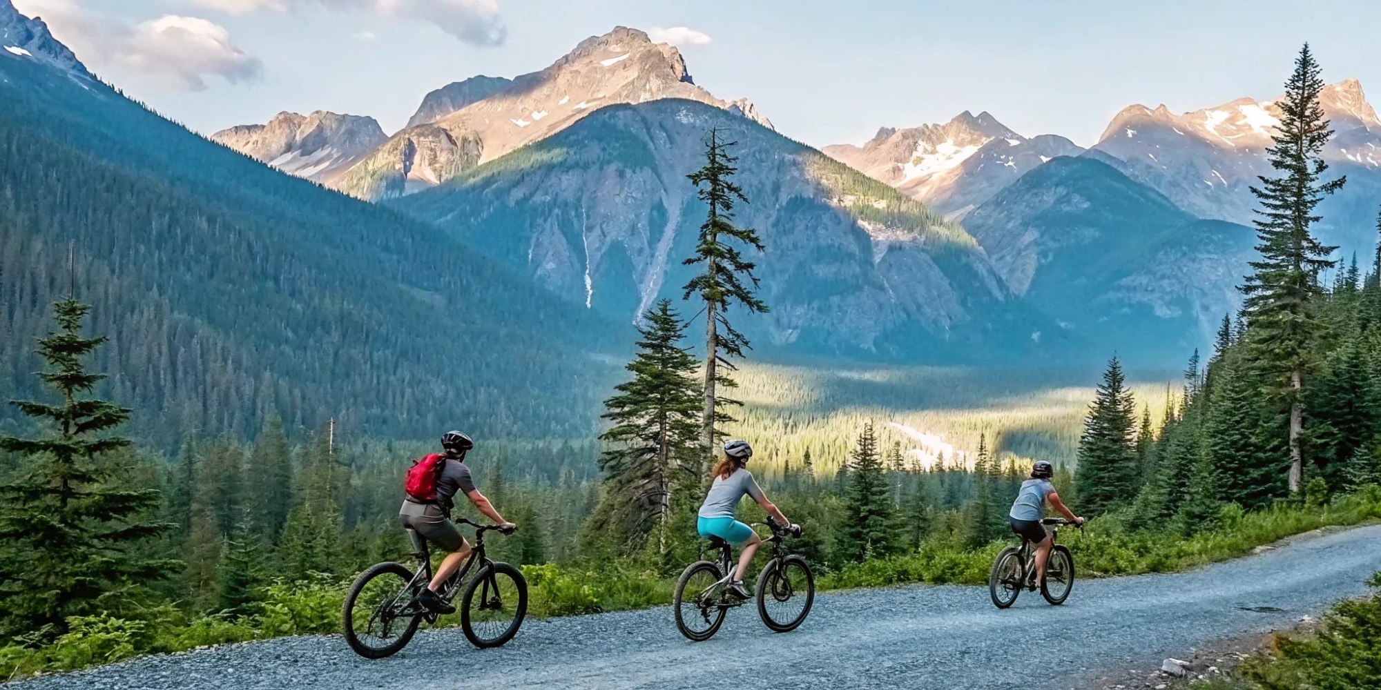 A guided private ebike tour through a Whistler forest with scenic mountain views.