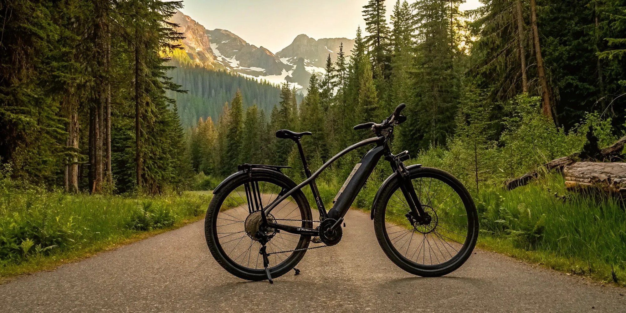 E-bike tour on a scenic mountain trail in Whistler at sunset.